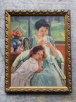 Front view showing artwork and ornate gold frame