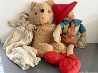 Group shot of three handmade fabric dolls