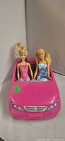 Front view of Barbie convertible with two dolls seated