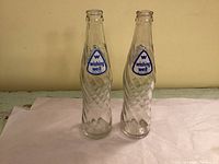 Two Wishing Well bottles front view showing labels and texture