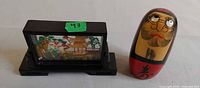 Overall view of Chinese cork diorama and Daruma Kokeshi doll