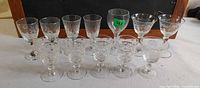 All twelve etched crystal stem glasses, group view