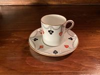 Cup on saucer showing pattern and gilt trim