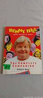 Front cover showing title, author, and Benny Hill imagery