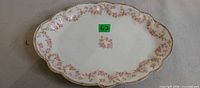 Top view of oval Bridal Rose platter showing pattern and gold rim