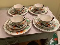 Full view of four complete place settings stacked