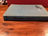 Spine view showing title Buckskin Colonist on blue cloth hardcover