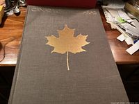 Front cover of Canada Gazetteer Atlas hardcover with gold maple leaf