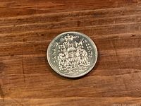 Reverse of 1969 Canadian 50 cent coin showing coat of arms