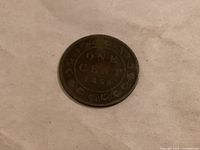 Reverse of 1859 one cent coin showing date and denomination