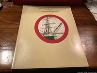 Front cover of the hardcover book showing title, author and ship image