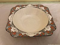 Top view showing Orange Tree pattern border and plain interior