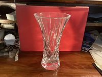 Front view of clear cut crystal vase on tabletop