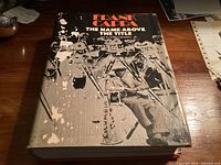 Front dust jacket showing title and wear