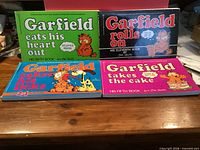 Front covers of four Garfield comic books