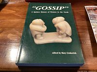 Front cover of book showing title and sculpture image