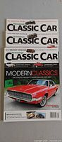 Stacked view of all three Hemmings Classic Car magazines showing covers and issue numbers