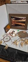 Overview of all items including framed print, small canvas, card, two dreamcatchers and beadwork