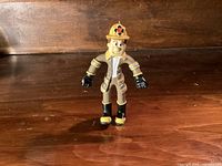Front view of KidKraft firefighter figure standing