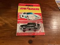 Front of sealed Majorette Saab 900 Turbo on card