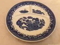 Top view showing Blue Willow pattern and three dividers