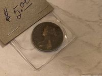 Obverse of 1861 New Brunswick One Cent coin in holder