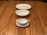 Platter, bowl, gravy boat on underplate displayed together