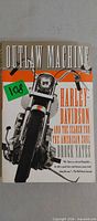 Front cover of paperback book showing title, subtitle, author, motorcycle image