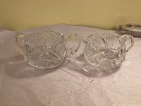 cream and sugar set front view showing pattern and handles