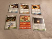All six Pokémon TCG cards laid out