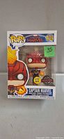 Front of sealed Funko Pop Captain Marvel #433 showing figure and stickers