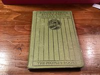 Front cover of olive cloth book showing title, series name, and vignette