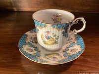 Cup on saucer showing full pattern and gilt trim