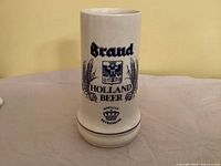 Front view showing Brand Holland Beer logo and graphics