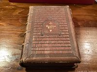 Front cover showing leather binding, embossing, gilt title