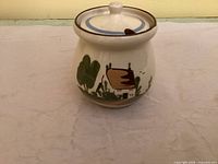 Front view showing cottage scene