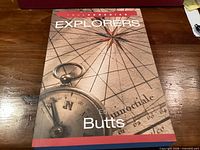 Front cover of book showing title, author, compass artwork