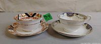 Both teacup and saucer sets side by side