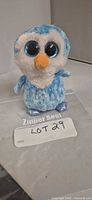Front view of Ty Beanie Boo Ice Cube owl plush standing upright