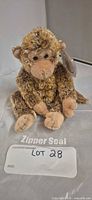 Front view of Ty Bonsai monkey plush showing face, paws and swing tag protector