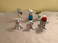 All six Dalmatian figurines grouped