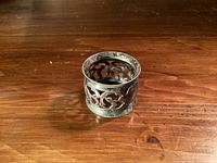Side view of pierced silverplate napkin ring