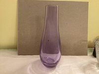 front view of purple glass vase showing shape and color