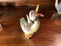 Oblique left view of entire figurine showing colouring and beak