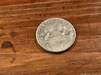 Reverse side showing CANADA, 1975 and canoe design