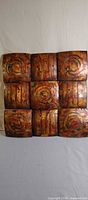 Front view of 3x3 metal wall art showing copper finish