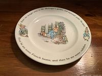 Front view of Peter Rabbit plate showing illustration and rim text