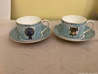 Front view of both cup and saucer sets