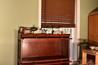 Overall view of wooden landmark pieces on cabinet top