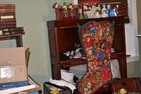 Oversized printed stocking hanging from shelving unit